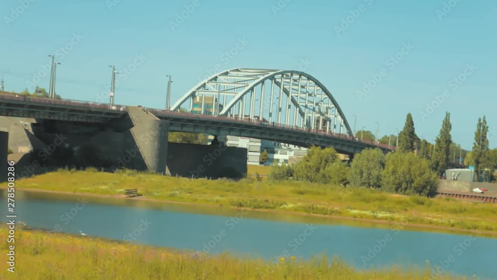 John Frost Bridge is the road bridge over the Lower Rhine at Arnhem, in the Netherlands. John Frost Bridge is the road bridge over the Lower Rhine at Arnhem, in the Netherlands.