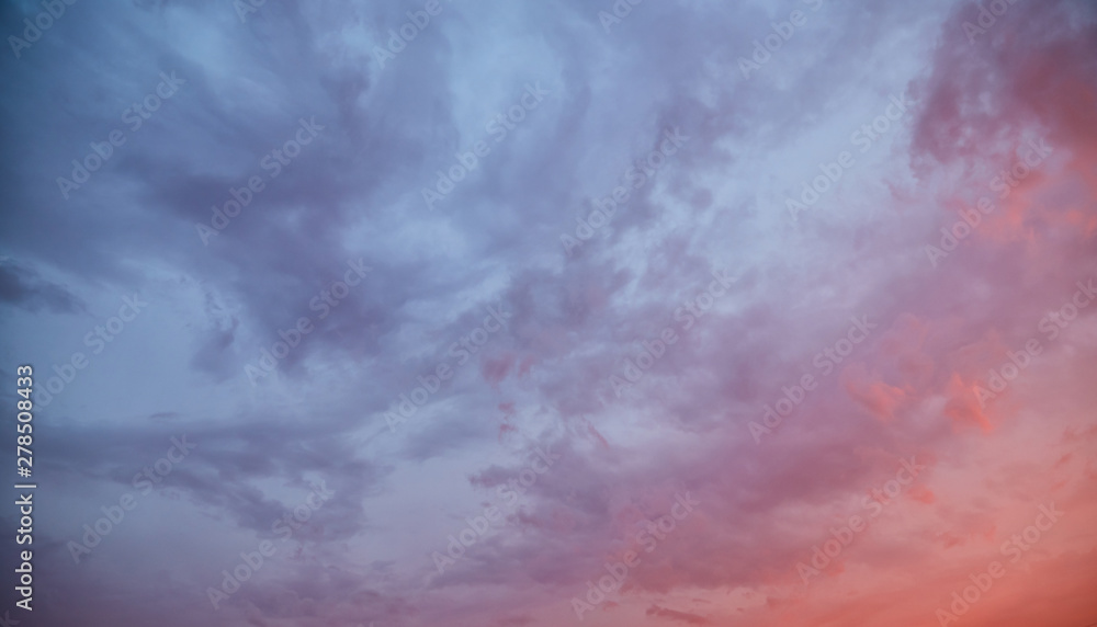 Dramatic sky at sunset with clouds lit by the setting sun Dramatic sky at sunset with clouds lit by the setting sun