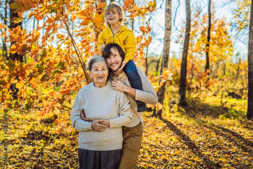 Grandmother and adult grandson hugging in autumn park Grandmother and adult grandson hugging in autumn park