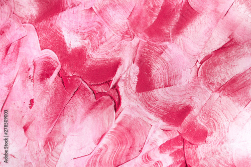 Pink holi powder explosion on white background