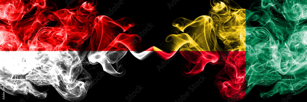 Obraz premium Indonesia vs Benin, Beninese smoky mystic flags placed side by side. Thick colored silky smoke flags of Indonesia and Benin, Beninese