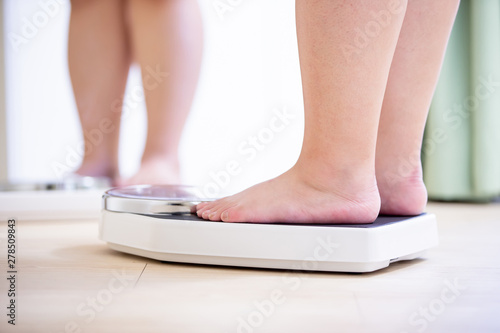plus size girl measure weight photo