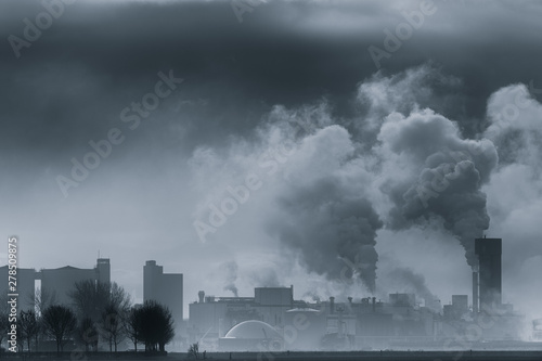 A chemical plant polluting the air and causing rising temperatures and global warming