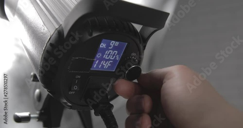 Setting up the photo studio light with umbrella. Detail