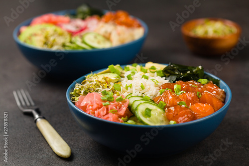 Fototapeta Naklejka Na Ścianę i Meble -  Hawaiian salmon poke bowl with seaweed, avocado, sesame seeds.
