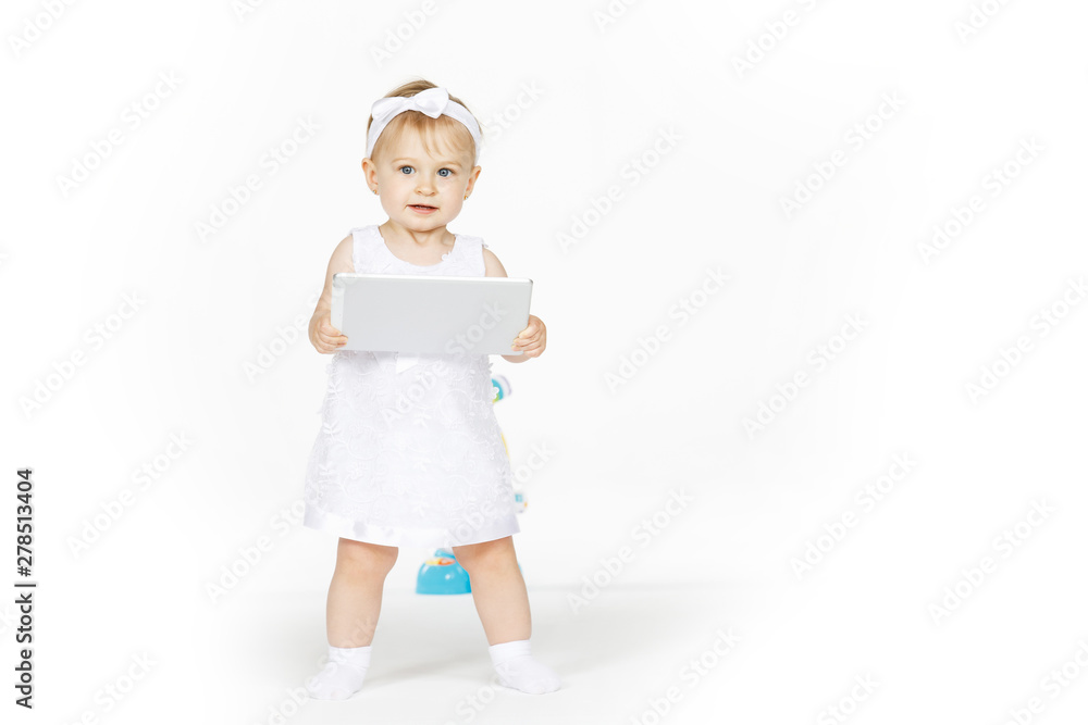 little girl all in white with a tablet little girl all in white with a tablet