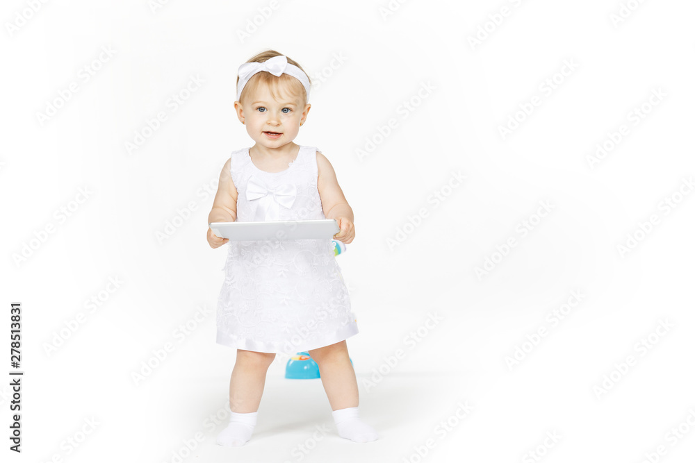 little girl all in white with a tablet little girl all in white with a tablet