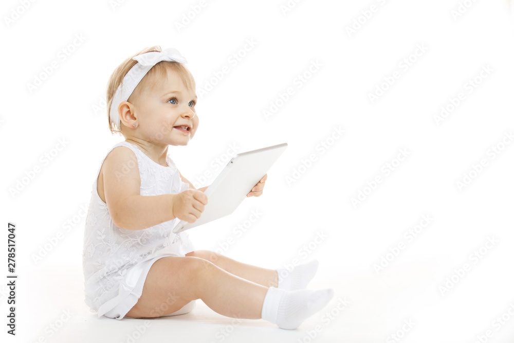 little girl all in white with a tablet little girl all in white with a tablet