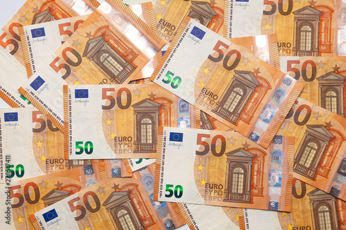 Pile of fifty 50 and hundred 100 euros EU bills background. EU note. Top view. Flat lay. Business concept