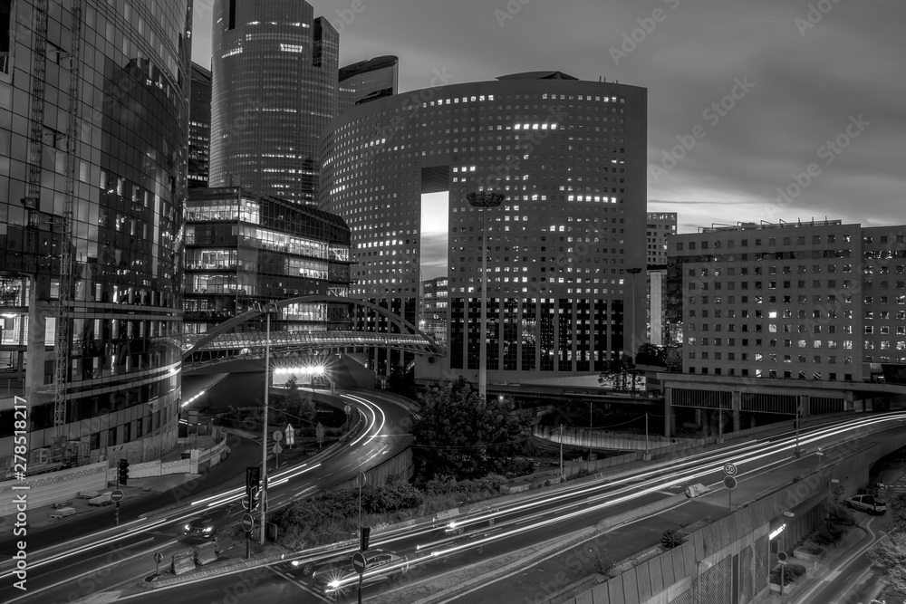 Evening Traffic Between Modern Buildings BW Evening Traffic Between Modern Buildings BW