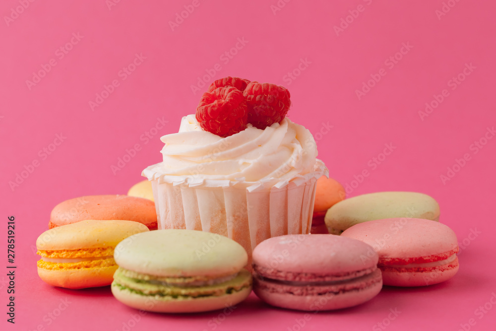 Yummy sweet cupcakes on light pink background