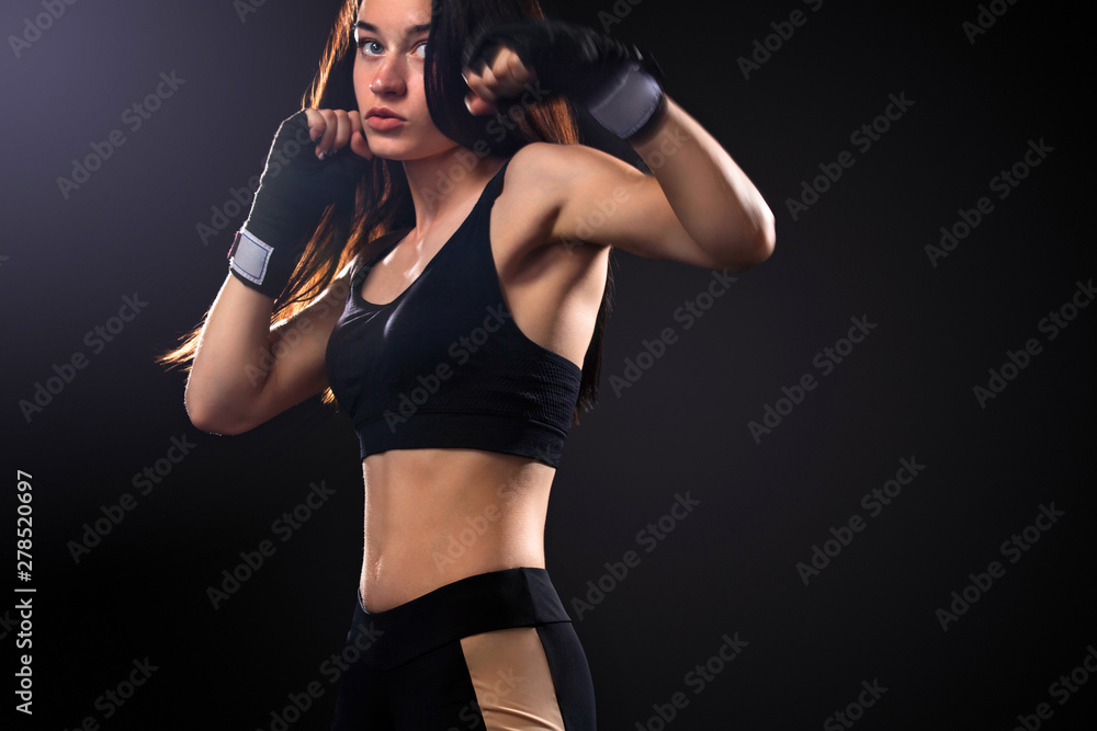 Sportsman, woman boxer fighting in gloves on black background. Boxing and fitness concept. Sportsman, woman boxer fighting in gloves on black background. Boxing and fitness concept.