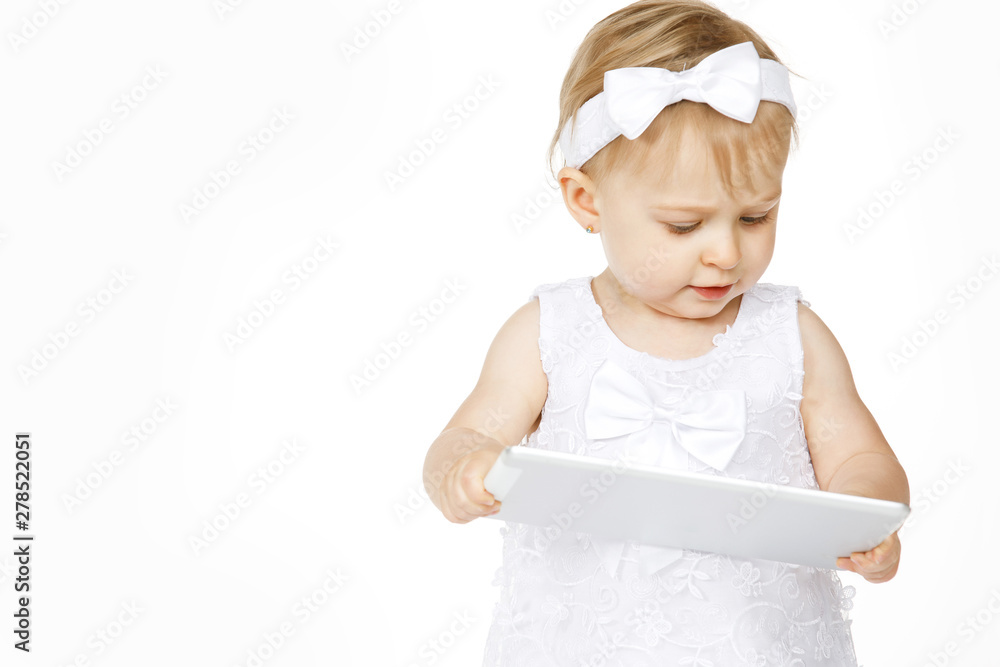 little girl all in white with a tablet little girl all in white with a tablet