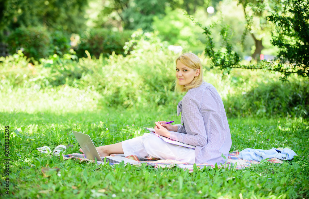 Remote job concept. Stay free with remote job. Managing business remote outdoors. Woman with laptop sit grass meadow. Best jobs to work remotely. Business lady freelance work outdoors