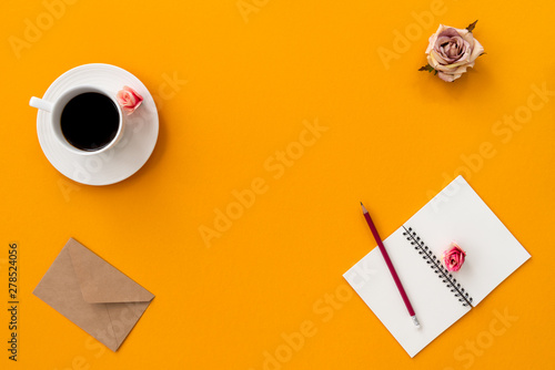 space orange vintage notebook with coffee and pencil