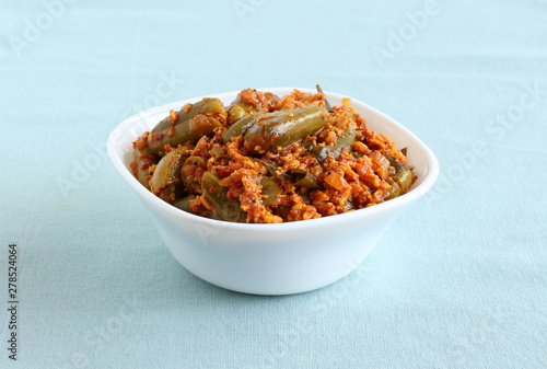 Ivy gourd or tindora curry is an Indian, vegetarian, and healthy side dish for items like chapati and roti. photo