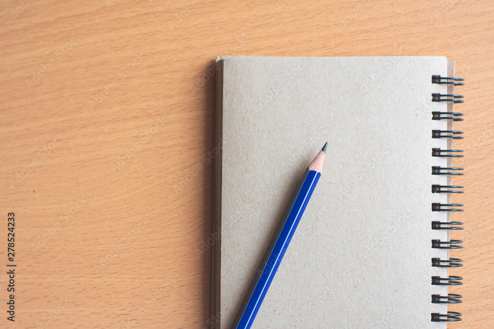 notebook and pen on wooden background notebook and pen on wooden background