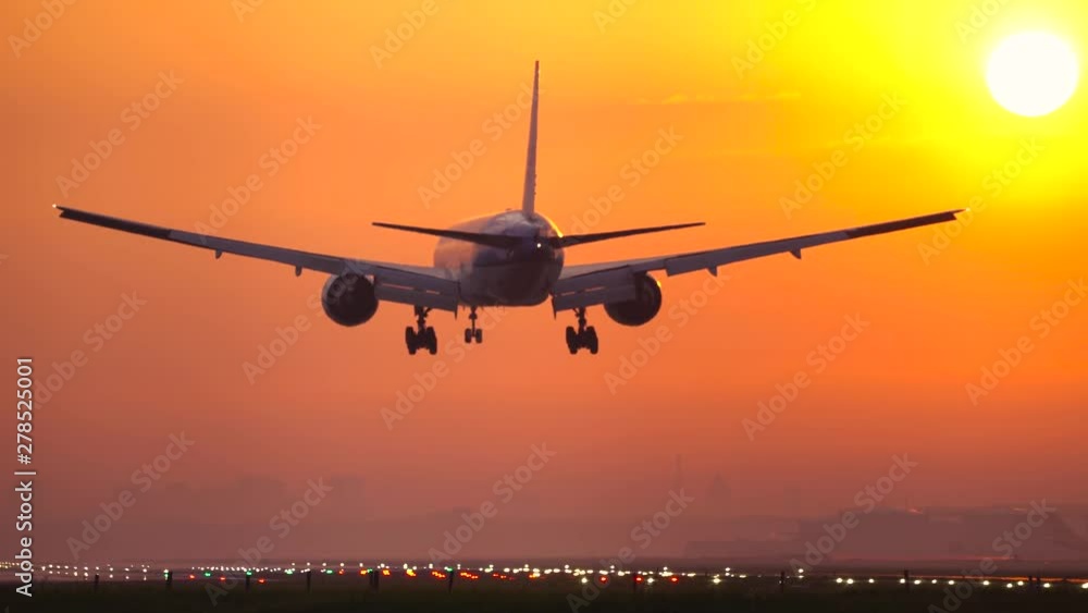 Big jet landing at sunset Big jet landing at sunset