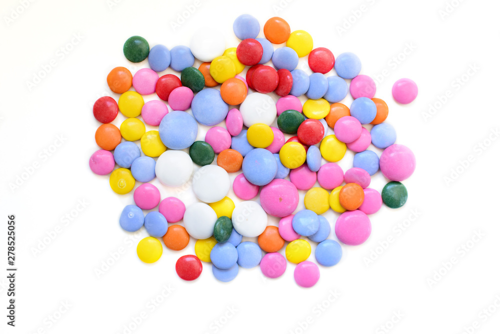 Chocolate dragee in a multi-colored glaze. Chocolate dragee in a multi-colored glaze.