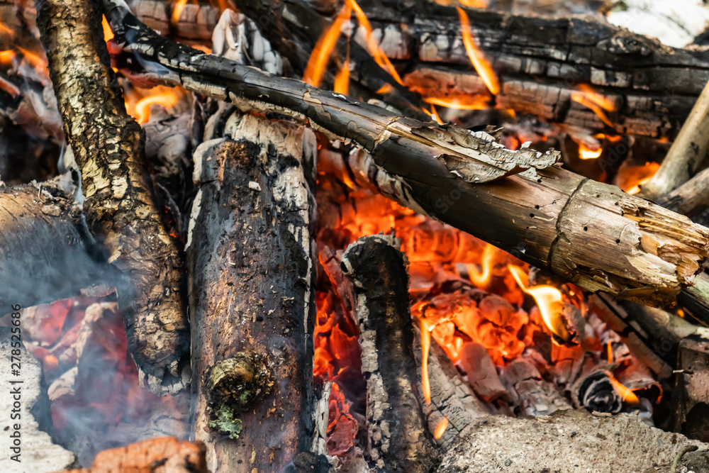 Dying bonfire. A fading bonfire. Dying bonfire. A fading bonfire.