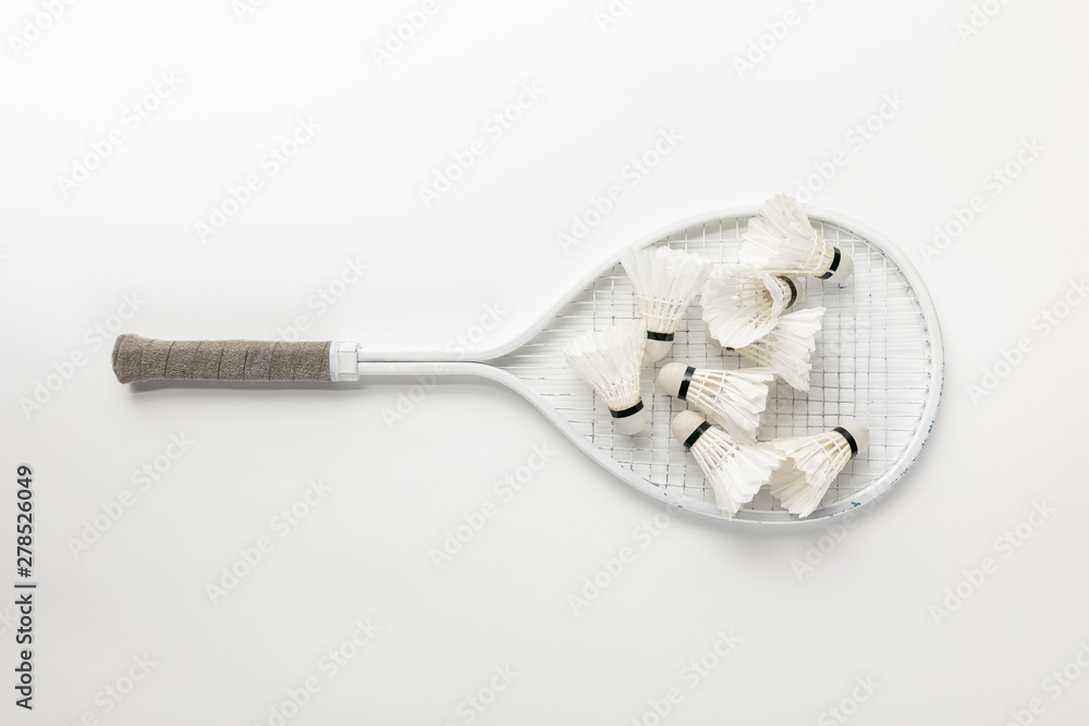 top view of white badminton racket with shuttlecocks on white background top view of white badminton racket with shuttlecocks on white background