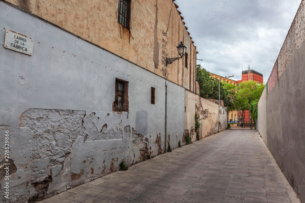 Ancient street in historic center of Sant Andreu quarter of Barcelona, Catalonia, Spain.