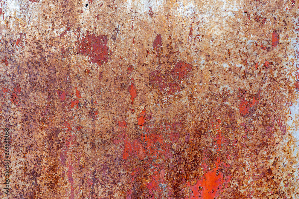 Background peeling red paint on a metal surface. Old painted metal door. Orange Paint is ripped off with metal. Background peeling red paint on a metal surface. Old painted metal door. Orange Paint is ripped off with metal.