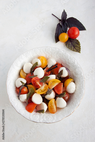 Fotografie Caprice Salad in a white plate