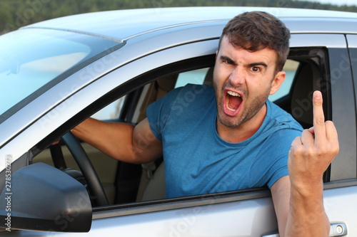 Angry driver showing middle finger  photo
