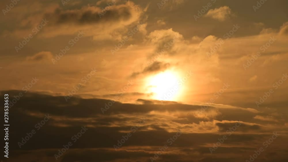 Superzoom plan timelapse sunset through sunset clouds in orange tones. Low key Superzoom plan timelapse sunset through sunset clouds in orange tones. Low key