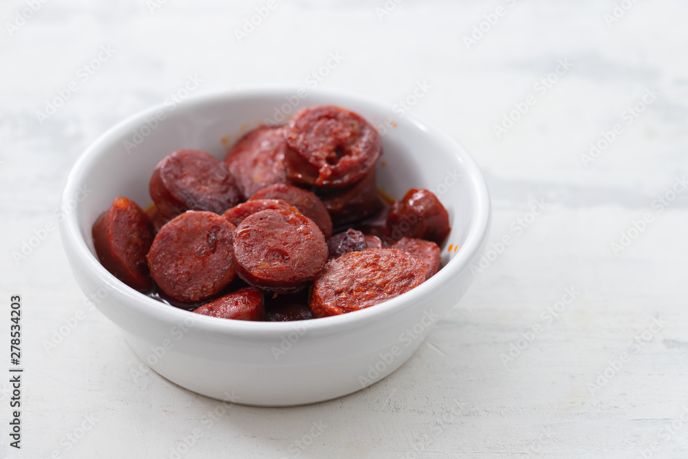 typical spanish sausage chorizo in white bowl typical spanish sausage chorizo in white bowl