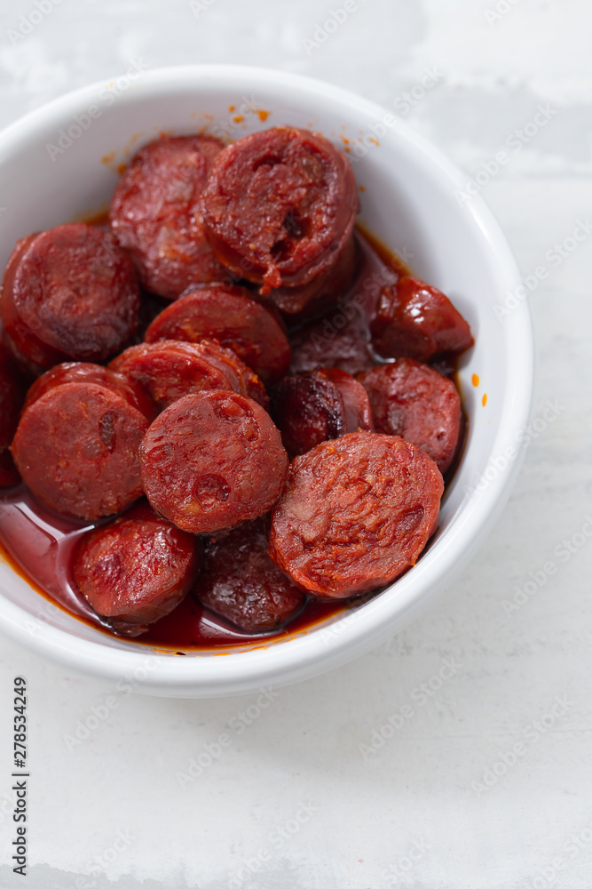 typical spanish sausage chorizo in white bowl typical spanish sausage chorizo in white bowl
