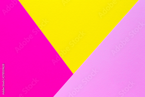 Light pink, dark pink and yellow pastel paper background for design.