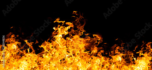 The biggest fire flames of realistic burning on black background. For art work design, banner or backdrop.