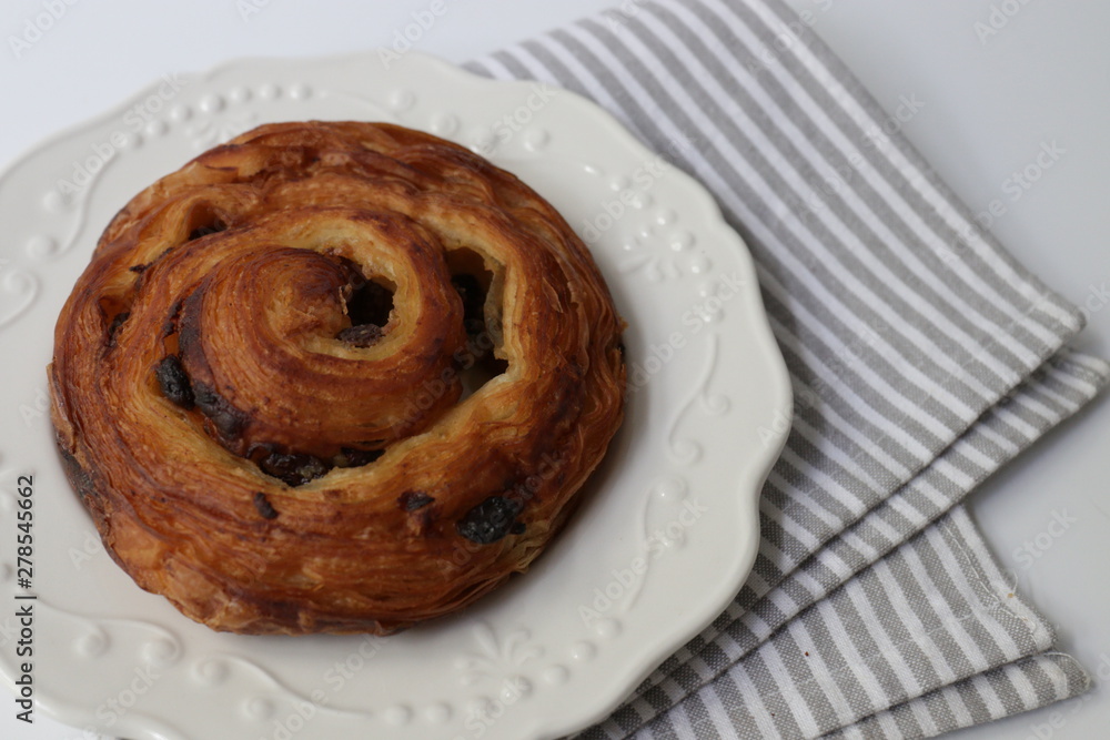 Close up Cinnamon Bun on White Background Close up Cinnamon Bun on White Background
