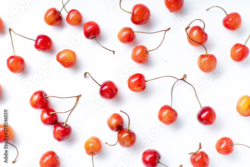 Top view image of fresh ripe red cherries isolated on white background
