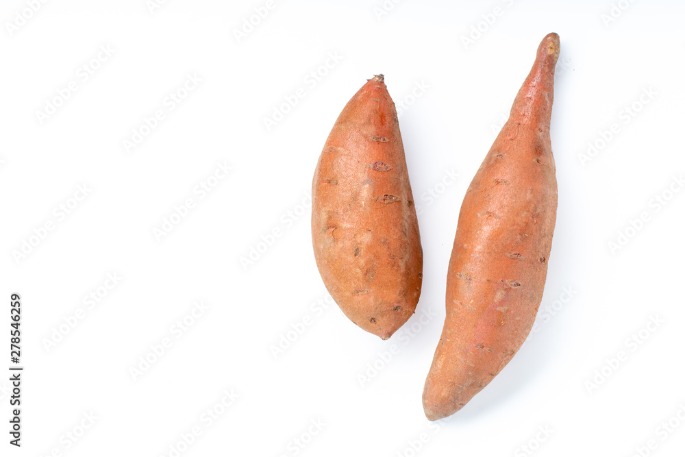 Two raw unpeeled isolated sweet potatoes on white background Two raw unpeeled isolated sweet potatoes on white background