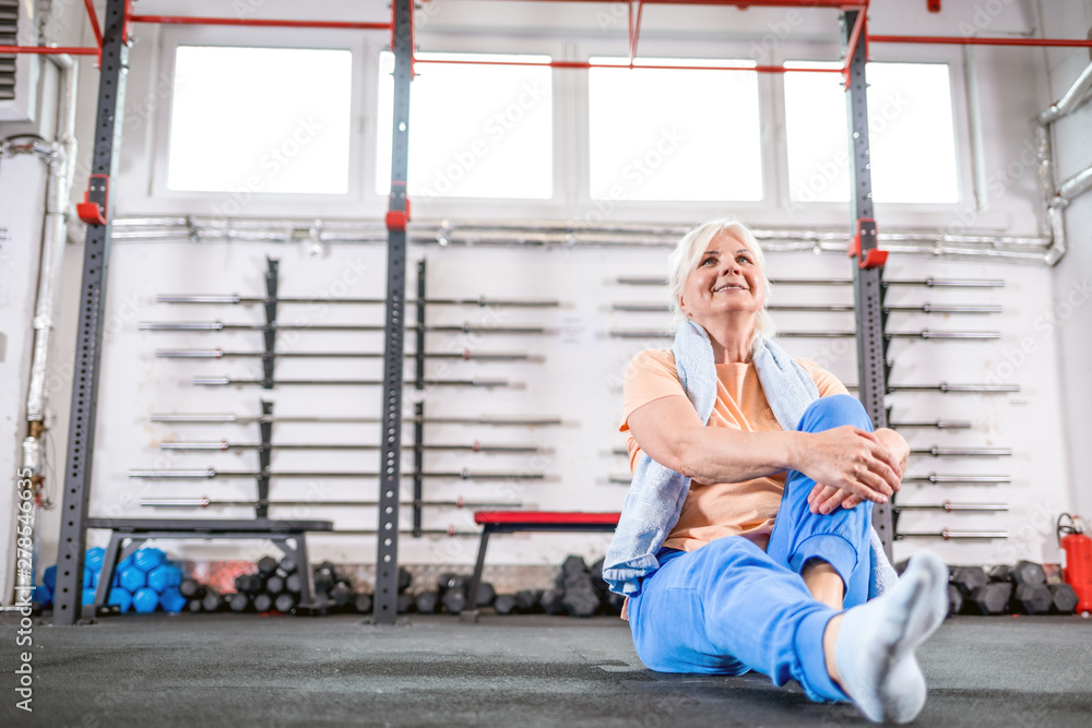 Fototapeta premium Happy senior woman in the fitness club