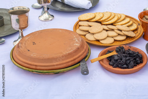 Medieval food on table of biscuits and fruit