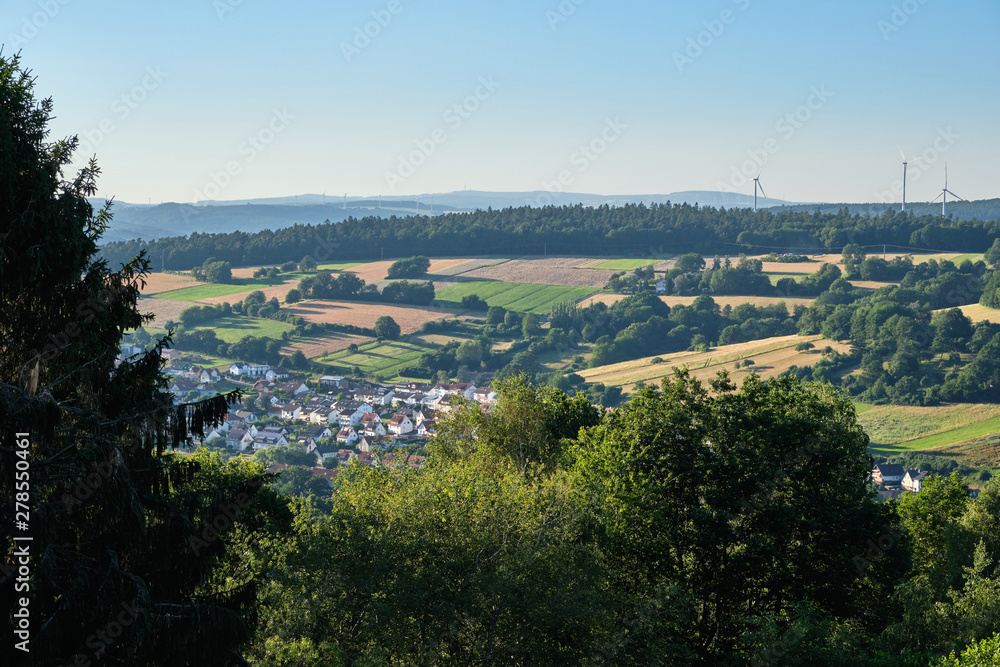 Bad Orb, Germany - June 28, 2019: Beautiful scenic view over the town of Bad Orb and the surrounding hills of the Spessart from the Wartturm on the Molkenberg