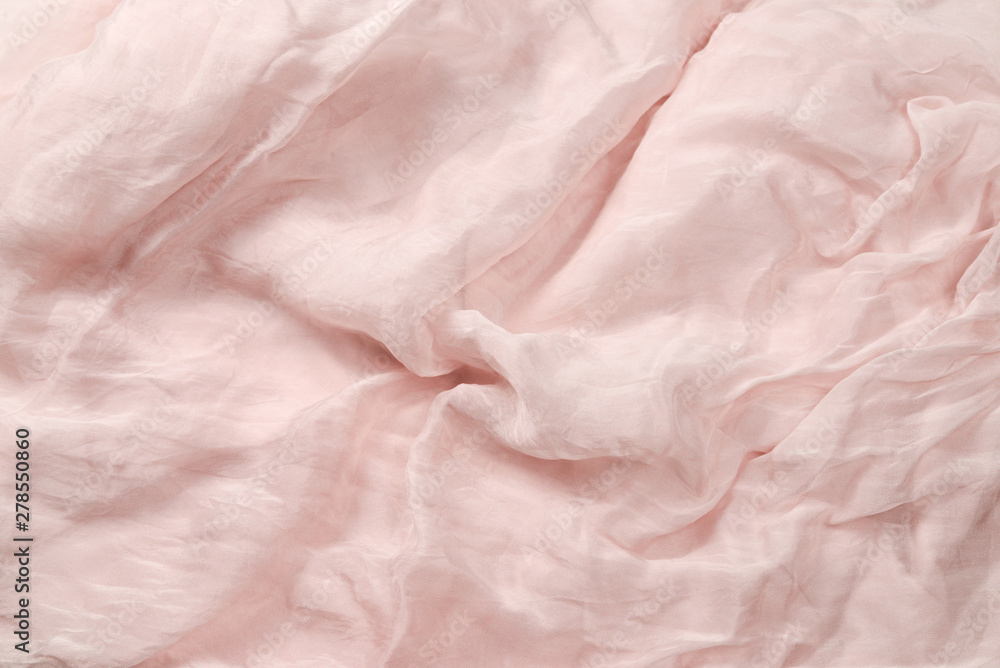 Fototapeta Soft smooth pink silk fabric background. Fabric texture.