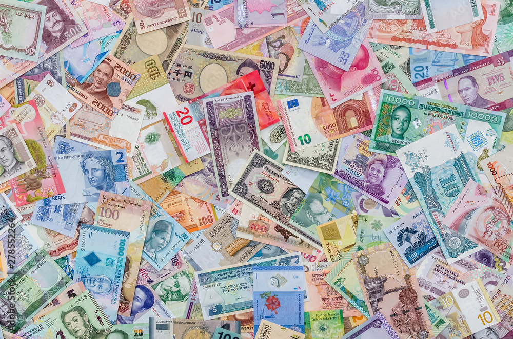 World money collection of different countries as background