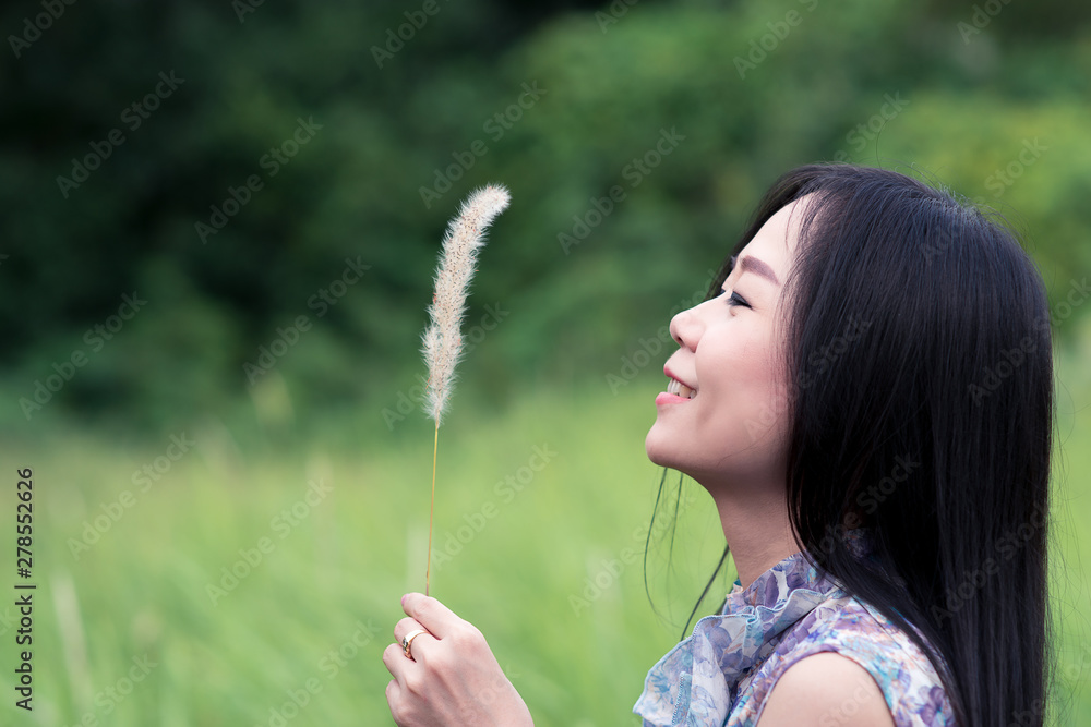 Freedom happy girl looking grass on the meadow field Freedom happy girl looking grass on the meadow field