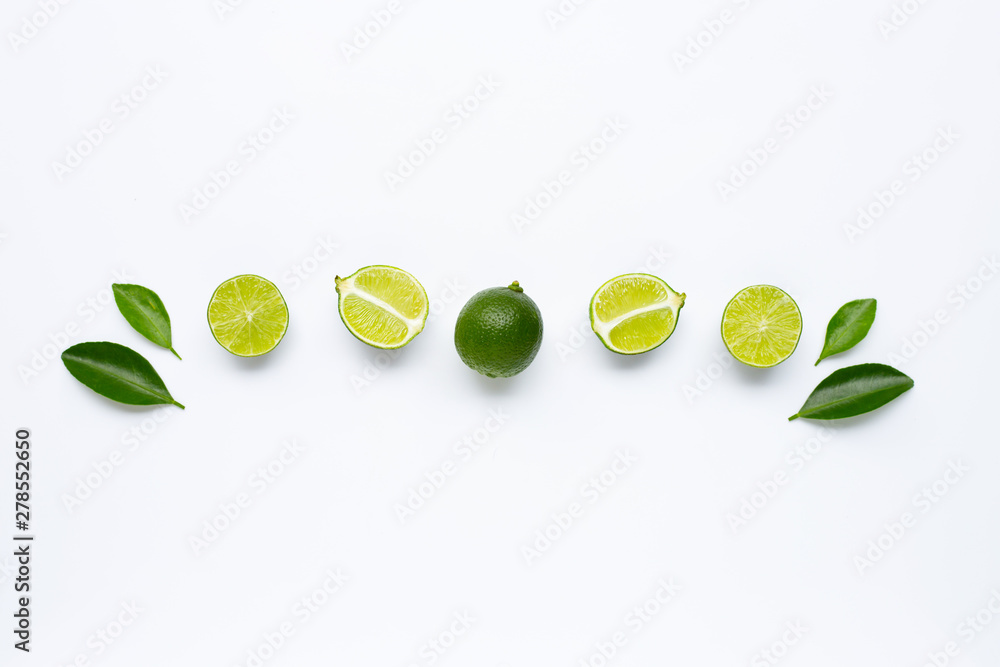 Fresh limes with leaves isolated on white Fresh limes with leaves isolated on white