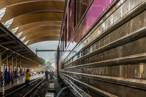 Cleaning staff while cleaning the train at Bangkok Railway Station or Hua Lamphong Railway Station is the main railway station in Bangkok, Thailand.