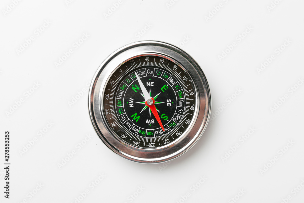 Close up of a compass on a white background Close up of a compass on a white background