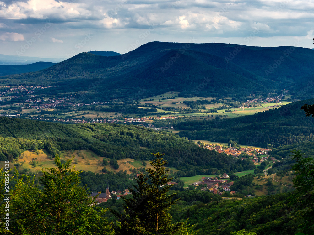 Spacious mountain landscape. A view from the mountain to the valley of Rhine and the village of Alsace.