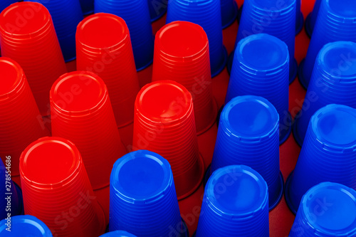 Plenty of plastic empty colorful cups close up