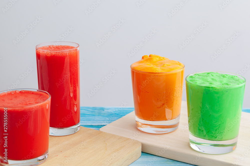 Row of healthy fresh fruit and vegetable smoothies Row of healthy fresh fruit and vegetable smoothies