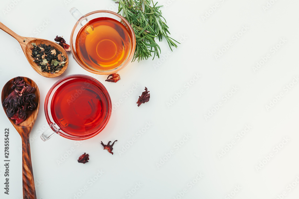 Tea in a glass cup with spices and herbs. Top view. Tea in a glass cup with spices and herbs. Top view.
